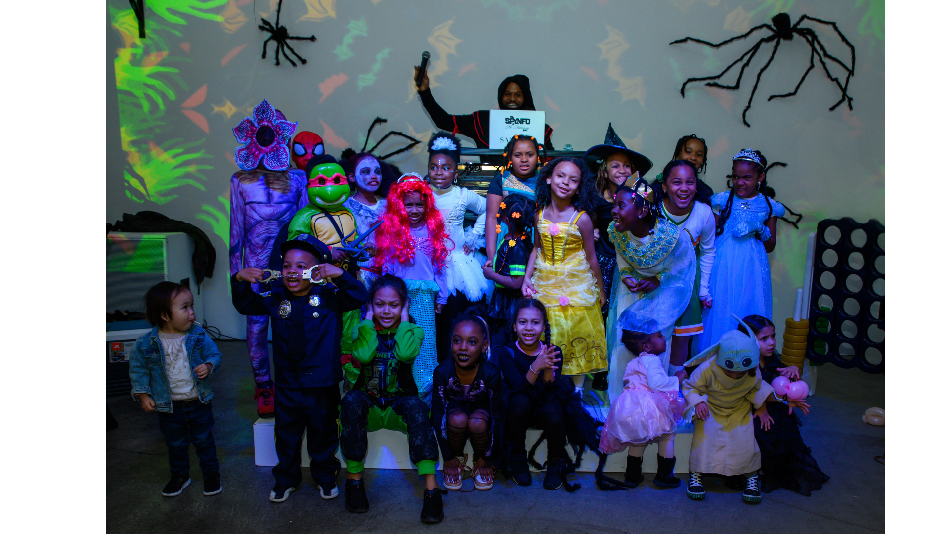 Children in Halloween costumes at a R.I.C.H. Foundation Trunk-or-Treat community event.